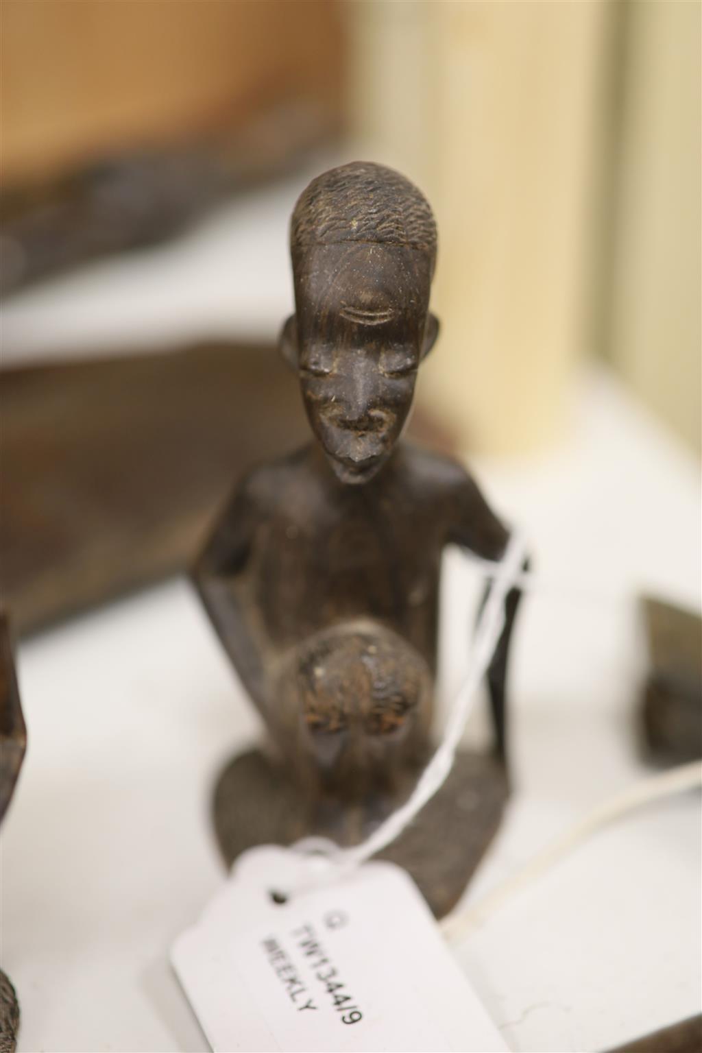 Ethnographia, a collection of various wood carvings, including an African tall female fertility figure,